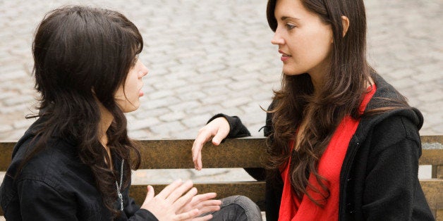 Teenage girl and woman talking