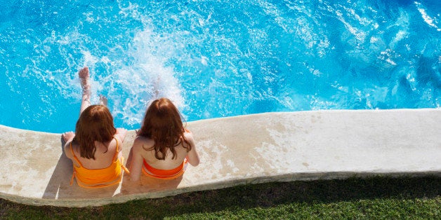 Girls Sitting Poolside