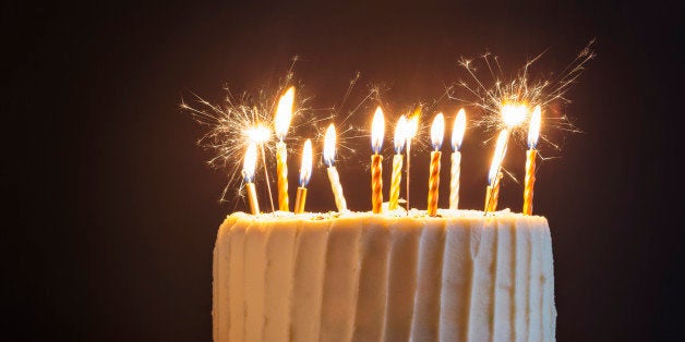 Birthday cake with candles and sparklers.