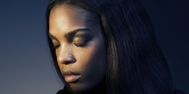 Side portrait of a dark skinned female,eyes closed