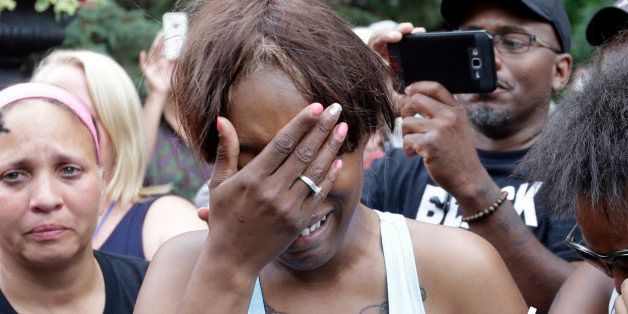 Diamond Reynolds, the girlfriend of Philando Castile of St. Paul, cries outside the governor's residence in St. Paul, Minn., on Thursday, July 7, 2016. Castile was shot and killed after a traffic stop by police in Falcon Heights, Wednesday night. A video shot by Reynolds of the shooting went viral. (AP Photo/Jim Mone)