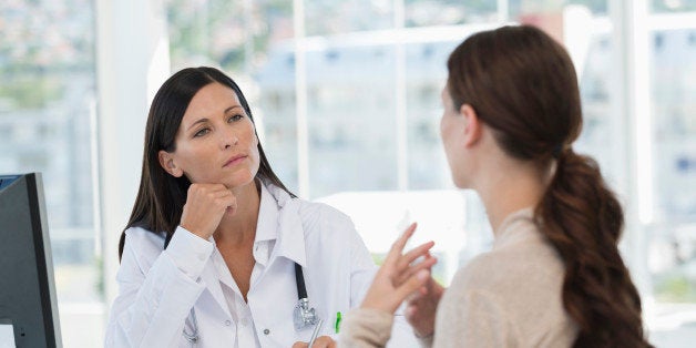 Female doctor discussing with a patient