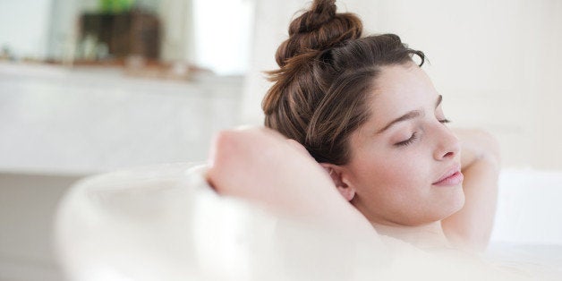 Woman relaxing in bubble bath