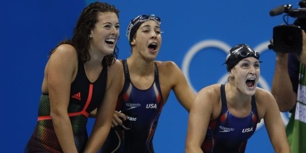 (FromL) USA's Allison Schmitt, USA's Madeline 'Maya' Dirado and USA's Leah Smith encourage their teammate USA's Katie Ledecky