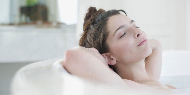 Woman relaxing in bubble bath