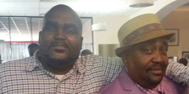 This undated photo provided by the Parks & Crump, LLC shows Terence Crutcher, left, with his father, Joey Crutcher. Crutc