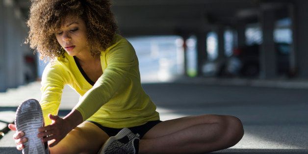Portrait of mixed race girl tying a shoelace before workout