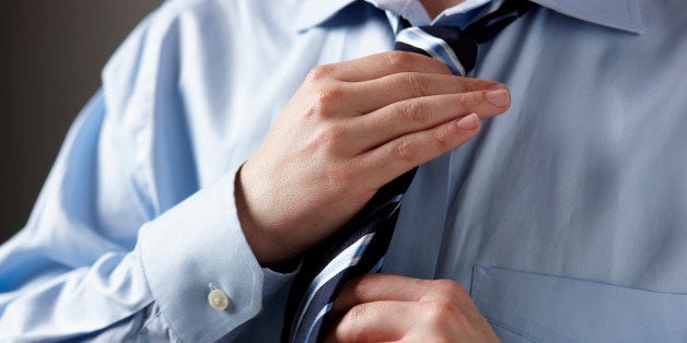 man tying tie