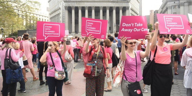 MANHATTAN, NEW YORK CITY, NEW YORK, UNITED STATES - 2015/09/29: Planned Parenthood activists in pink hold signs in front the US courthouse. Activists and directors of Planned Parenthood, NYC, gathered in Foley Square along NYC first lady Chirlane McCray and elected representatives to demonstrate support for the organization. (Photo by Andy Katz/Pacific Press/LightRocket via Getty Images)