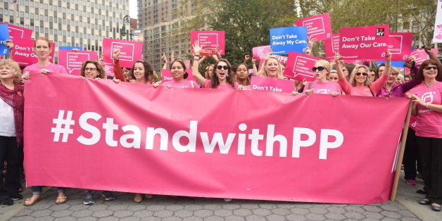 MANHATTAN, NEW YORK CITY, NEW YORK, UNITED STATES - 2015/09/29: Activists hold Planned Parenthood banner in Foley Square. Act