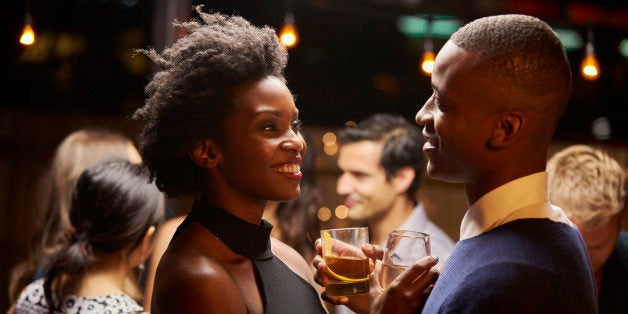 Couples Dancing And Drinking At Evening Party