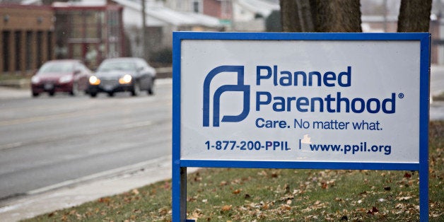 Signage is displayed outside a Planned Parenthood office in Peoria, Illinois, U.S., on Friday, Dec. 16, 2016. Republicans are