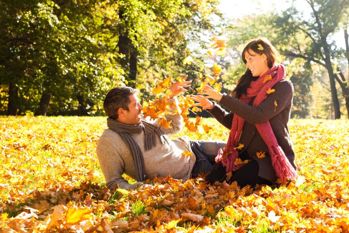 Portrait of couple enjoying golden autumn fall season