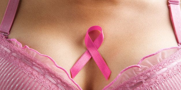 pink ribbon in woman chest to support breast cancer cause