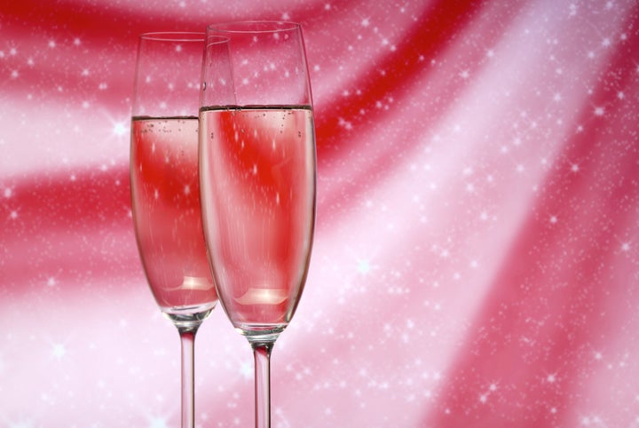 Glasses with champagne on an abstract background