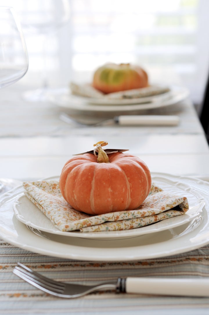 Festive autumn place settings with pumpkins