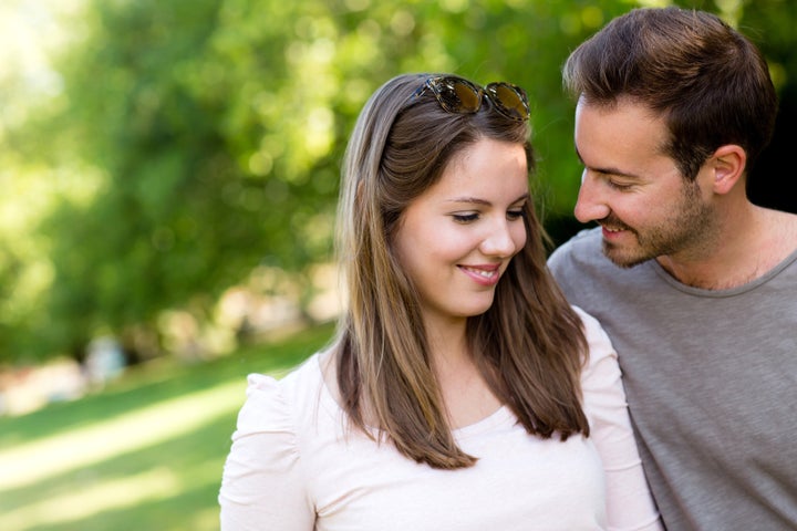 Portrait of an affectionate couple flirting outdoors