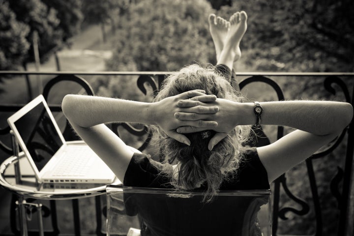 young woman relaxing on the balkony