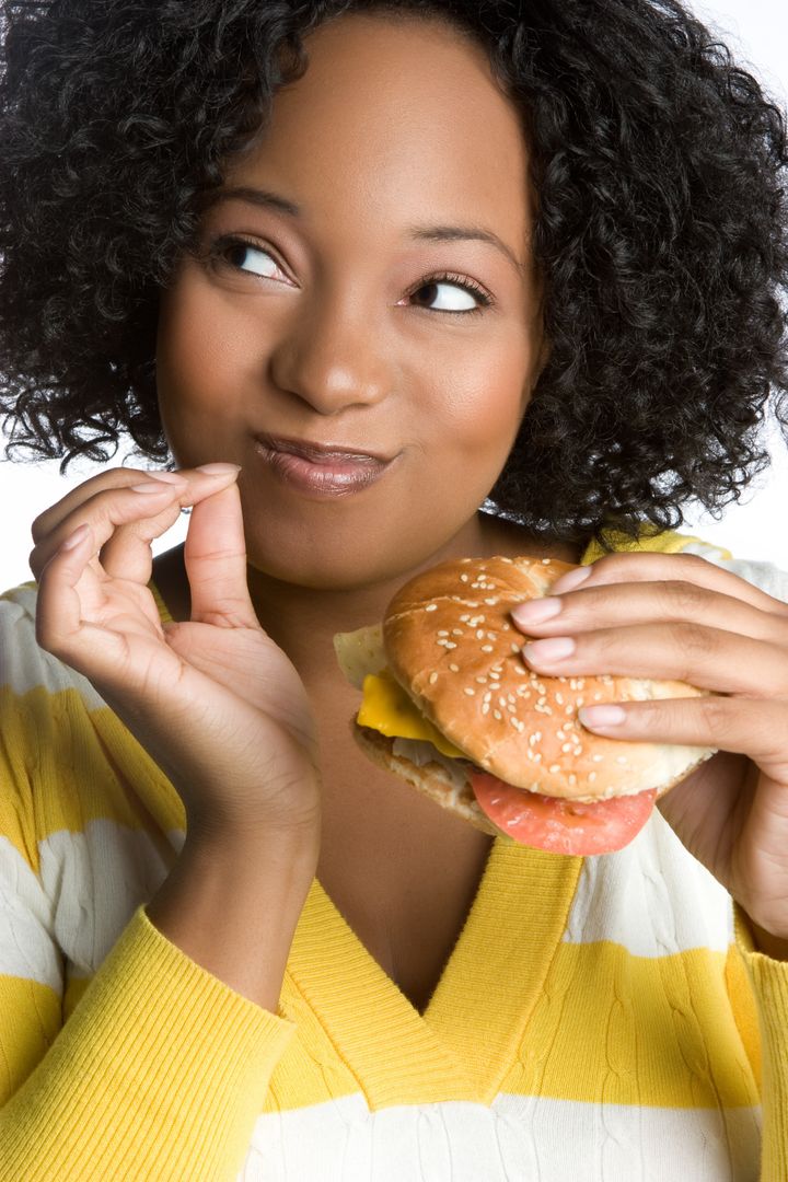 Woman Eating Hamburger