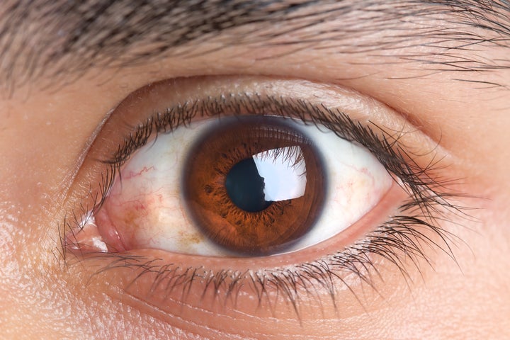 portrait of brown eye of young man