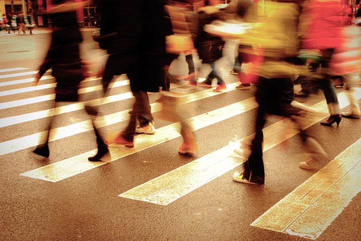 people on zebra crossing street