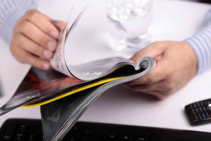 Man reading Magazine in Office