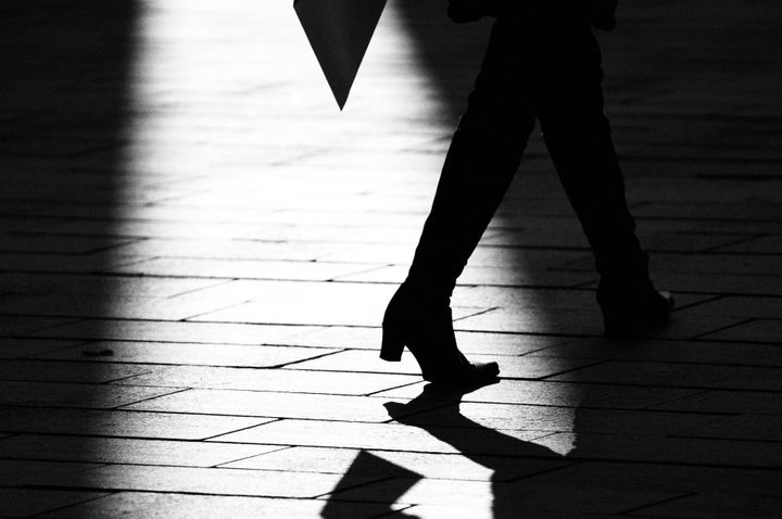 walking lady in a dark shade...