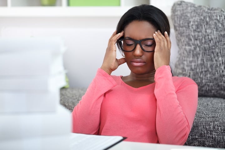 exhausted student woman has a headache