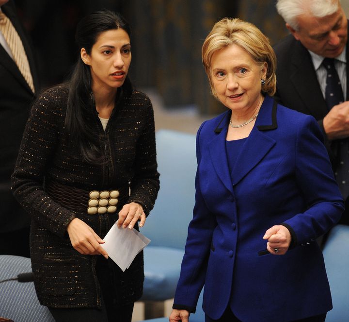 US Secretary of State Hillary Clinton (R) and aide Huma Abedin speak before Clinton chaired the Security Council Session on Women, Peace and Security during which the council voted on a resolution to address sexual violence in armed conflict September 30, 2009 at UN headquarters in New York. AFP PHOTO/Stan HONDA (Photo credit should read STAN HONDA/AFP/Getty Images)