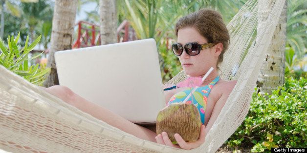 Young woman working on vacation