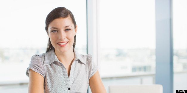 Smiling businesswoman in conference room