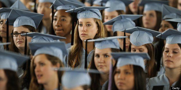 Graduates listen to US President Barack Obama as he delivers the Commencement Address at Barnard College's graduation ceremony in New York on May 14, 2012. AFP PHOTO/TIMOTHY A. CLARY (Photo credit should read TIMOTHY A. CLARY/AFP/GettyImages)