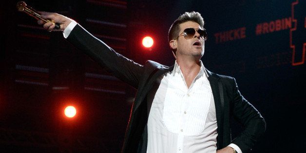 LOS ANGELES, CA - JUNE 30: Singer Robin Thicke performs onstage during the 2013 BET Awards at Nokia Theatre L.A. Live on June 30, 2013 in Los Angeles, California. (Photo by Kevin Winter/Getty Images for BET)
