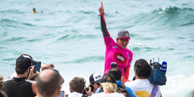 CASCAIS, PORTUGAL - OCTOBER 5: Carissa Moore from Hawaii celebrates taking the win and the world title at EDP Girls Pro on Oc