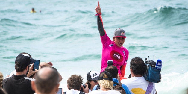 CASCAIS, PORTUGAL - OCTOBER 5: Carissa Moore from Hawaii celebrates taking the win and the world title at EDP Girls Pro on October 5, 2013 in Cascais, Portugal. (Photo by Damien Poullenot/ASP via Getty Images)