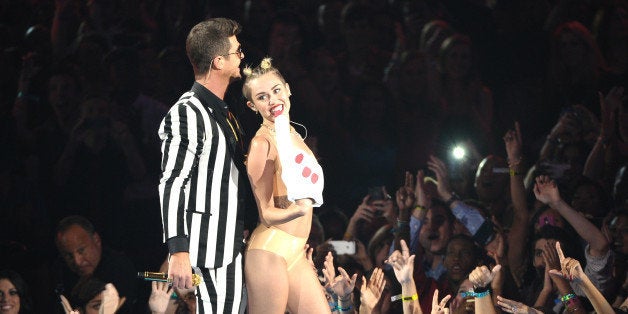 NEW YORK, NY - AUGUST 25: Robin Thicke and Miley Cyrus perform during the 2013 MTV Video Music Awards at the Barclays Center on August 25, 2013 in the Brooklyn borough of New York City. (Photo by Michael Loccisano/FilmMagic)