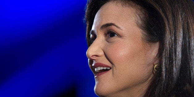 Sheryl Sandberg, chief operating officer of Facebook Inc., reacts during a demonstration at the DreamForce Conference in San Francisco, California, U.S., on Wednesday, Nov. 20, 2013. Salesforce.com Inc. introduced an overhauled version of its mobile software, seeking to ensure clients and partners will be able to use more features of the company's sales, marketing and customer service software. Photographer: David Paul Morris/Bloomberg via Getty Images 