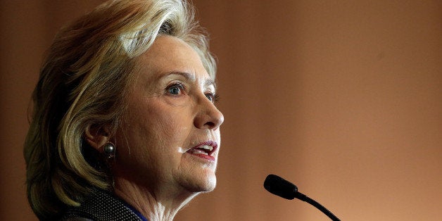 WASHINGTON, DC - DECEMBER 06: Former U.S. Secretary of State Hillary Clinton delivers remarks after being presented the 2013