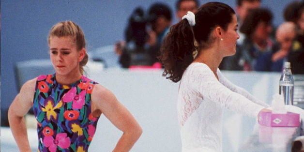 FILES, NORWAY - DECEMBER 15: US figure skaters Tonya Harding (L) and Nancy Kerrigan avoid each other during a training session 17 February in Hamar, Norway, during the Winter Olympics. Kerrigan was hit on the knee in January 1994 during the US Olympic Trials and it was later learned that Harding's ex-husband and bodyguard masterminded the attack in hopes of improving Harding's chances at the US Trials and the Olympics. (COLOR KEY: Harding has yellow) (Photo credit should read VINCENT AMALVY/AFP/Getty Images)