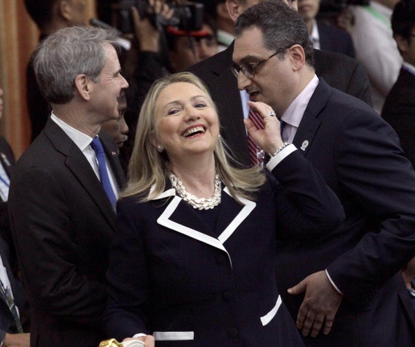 U.S. Secretary of State Hillary Rodham Clinton, center, reacts before the 2nd East Asia Summit Foreign Ministers' Meeting at 