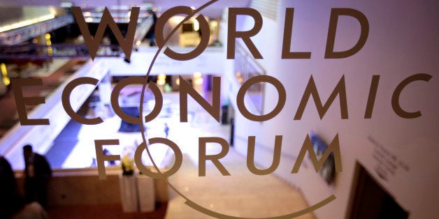 The World Economic Forum (WEF) logo sits on a glass wall inside the Congress Center in Davos, Switzerland, on Monday, Jan. 20, 2014. This week the business elite will gather in the Swiss Alps for the 44th annual meeting of the World Economic Forum (WEF) in Davos for the five day event which runs from Jan. 22-25. Photographer: Jason Alden/Bloomberg via Getty Images