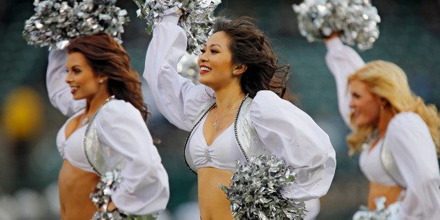 OAKLAND, CA - NOVEMBER 03: Oakland Raiderettes dance during a timeout between the Oakland Raiders and the Philadelphia Eagles in the fourth quarter on November 3, 2013 at O.co Coliseum in Oakland, California. The Eagles won 49-20. (Photo by Brian Bahr/Getty Images)