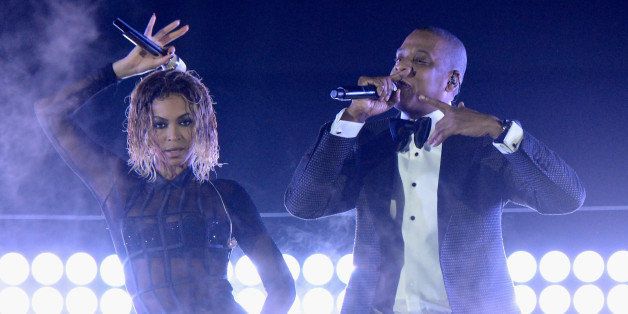 LOS ANGELES, CA - JANUARY 26: Singer Beyonce (L) and rapper Jay-Z onstage during the 56th GRAMMY Awards at Staples Center on January 26, 2014 in Los Angeles, California. (Photo by Kevin Mazur/WireImage)