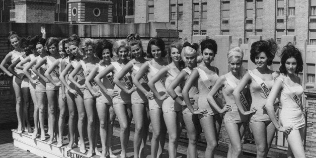 circa 1965: Full-length portrait of nineteen of the contestants in the Miss Universe pageant posing in swimsuits, sashes and high heels, on the roof of the Belmont Plaza Hotel in New York City. (Photo by Agence France Presse/Agence France Presse/Getty Images)