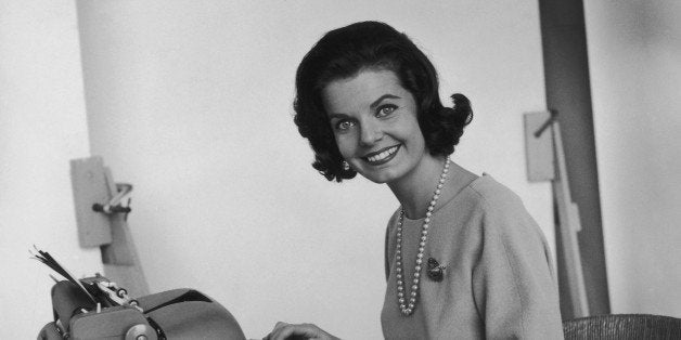 A cheerful typist at her work, circa 1965. (Photo by FPG/Hulton Archive/Getty Images)