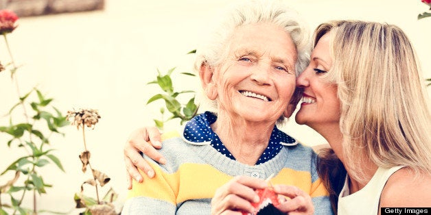 Happy elderly lady knitting