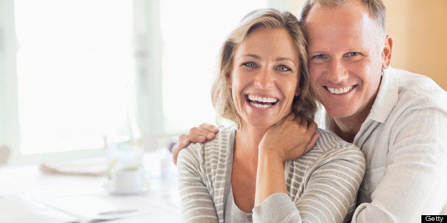 Portrait of happy couple at the breakfast table