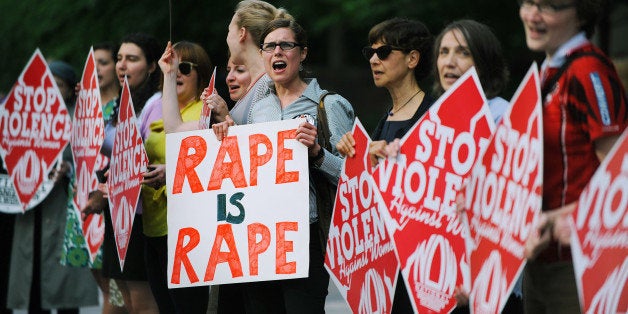 Feminist leaders and activists hold a protest in front of the International Monetary Fund (IMF) Headquarters demanding that IMF Managing Director Dominique Strauss-Kahn be removed from his post in Washington, DC, on May 18 2011. Strauss-Kahn resigned his post via a letter sent from jail on May 18. AFP PHOTO/STR (Photo credit should read STR/AFP/Getty Images)