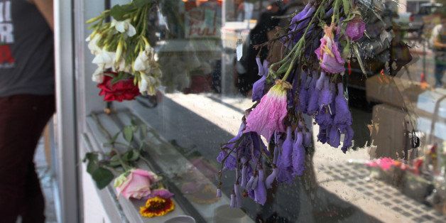 ISLA VISTA , CA - MAY 25: Flowers fill bullet holes in the windows of the IV Deli on May 25, 2014 in Isla Vista, California. According to reports, 22 year old Elliot Rodger, son of assistant director of the Hunger Games, Peter Rodger, began his mass killing near the University of California in Santa Babara by stabbing three people to death in an apartment. He then went on to shooting people while driving his BMW and ran down at least one person until crashing with a self-inflicted gunshot wound to the head. Officers found three legally-purchased guns registered to him inside the vehicle. Prior to the murders, Rodger posted YouTube videos declaring his intention to annihilate the girls who rejected him sexually and others in retaliation for his remaining a virgin at age 22. Seven people died, including Rodger, and seven others wounded, according to authorities. (Photo by David McNew/Getty Images)