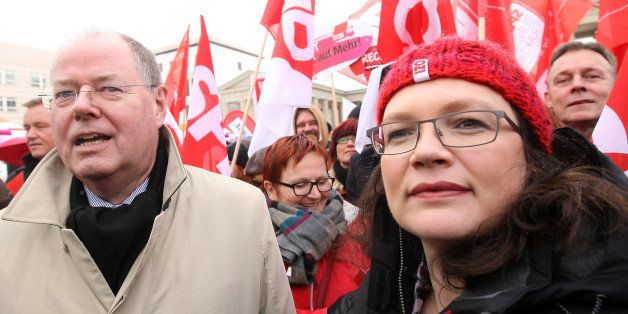 BERLIN, GERMANY - MARCH 21: Peer Steinbrueck (L), chancellor candidate of the German Social Democrats (SPD) and Andrea Nahles (R), general secretary of the SPD, and SPD Bundestag member Elke Ferner attend an Equal Pay Day rally in front of the Brandenburg Gate on March 21, 2013 in Berlin, Germany. The annual event recognizes the wage gap between women and men in the country, where women's salaries still lag behind that of men, particularly in the states that were once East Germany. (Photo by Adam Berry/Getty Images)
